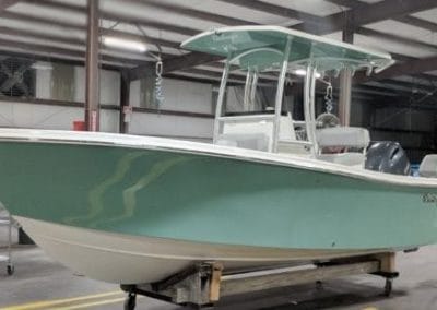 side view of a green challenger boat