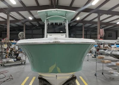 front view of a green challenger boat